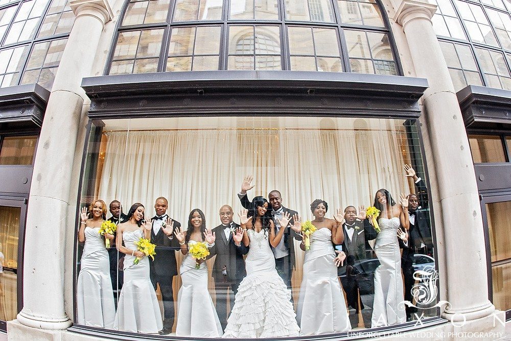 Wedding party strike a pose in the window at 200 Peachtree in downtown Atlanta