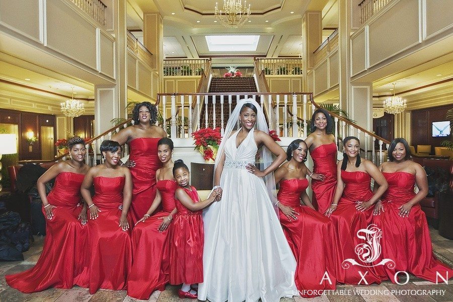 Bride and her party of 9 in strapless floor length burgundy dress in the lobby of the Augusta Marriott at the Convention Center