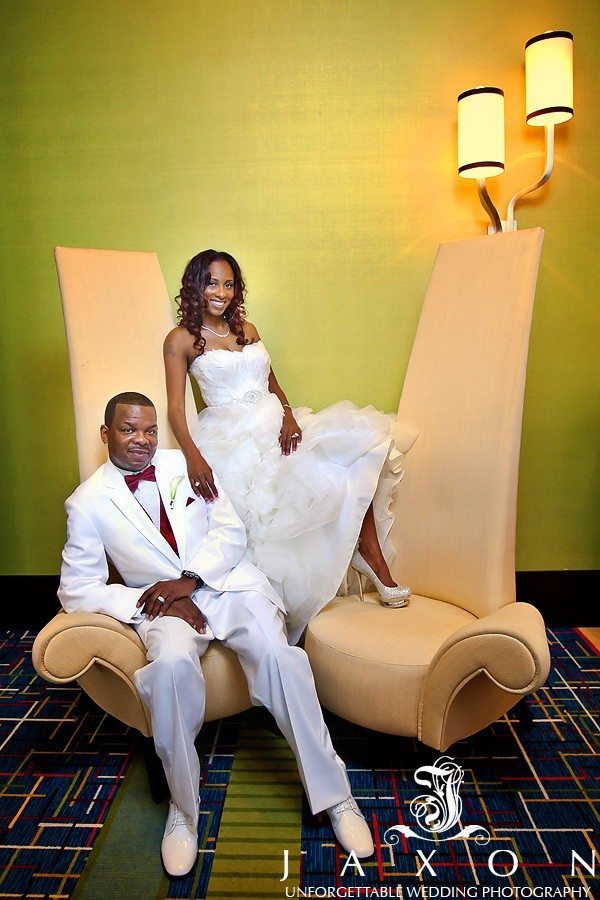 Bride and groom on fancy chair at Marriott Gateway Atlanta wedding