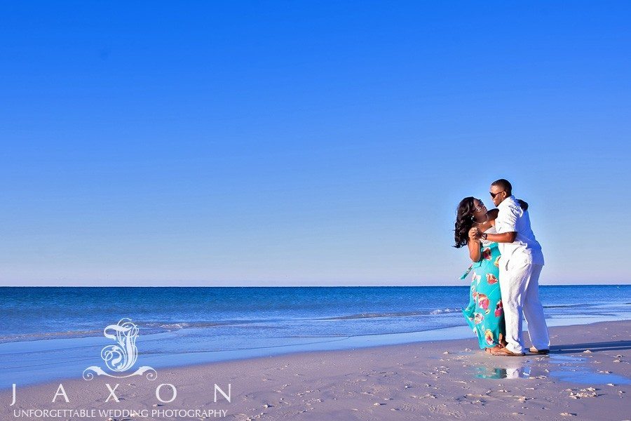 Couple dances on the beach in Destin FL during their engagement session