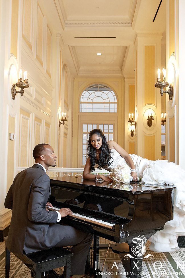 Groom plays his new bride a tune as she lays on Baby Grand Piano in the Piedmont Foyer