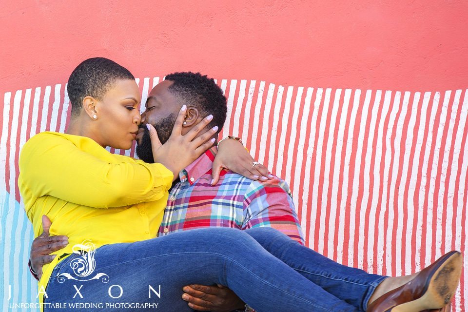 engagement photo against the colorful walls at Boulevard and Dekalb ave