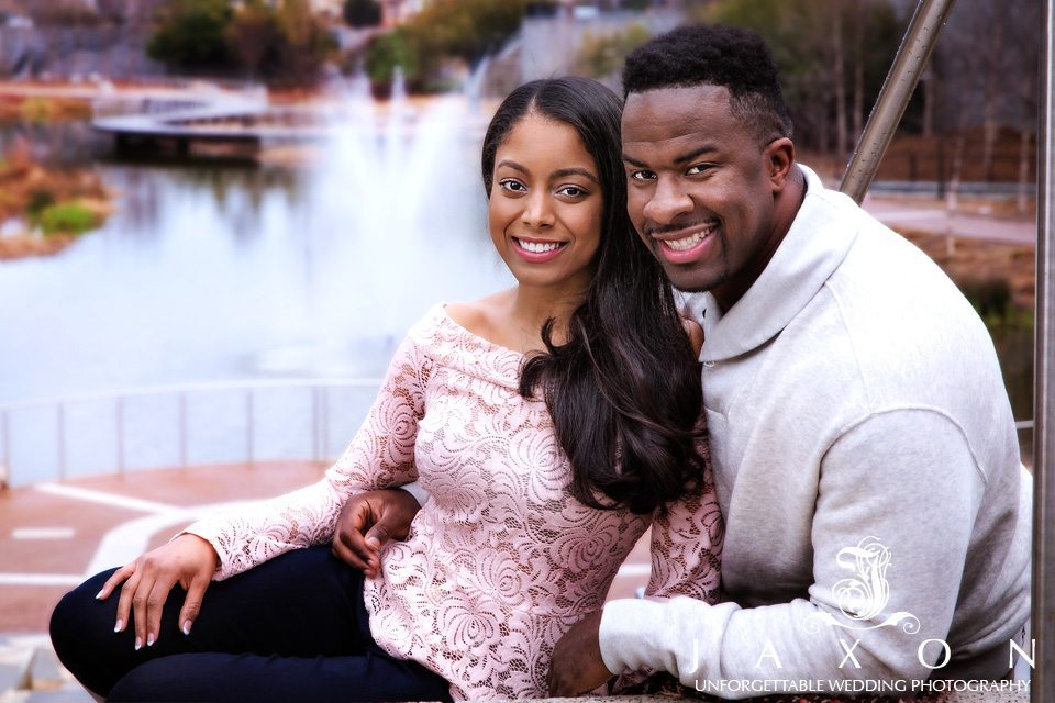 Couple on the steps at Old Fourth Ward Park, Clear Creek Basin water fountain and pedestrian bridge in background