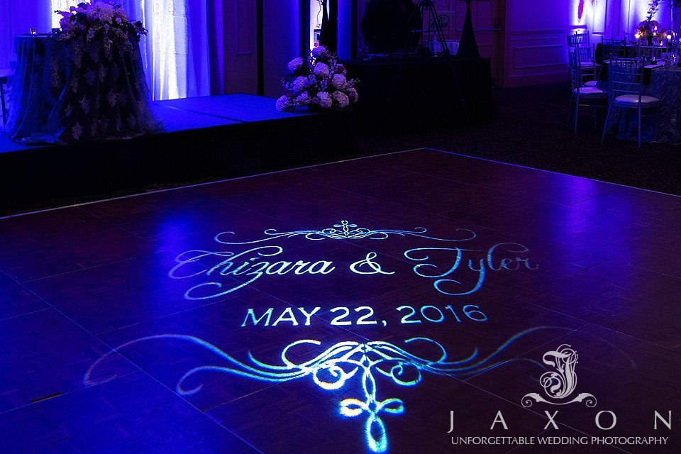 Couple's names and wedding sate projected on dance floor